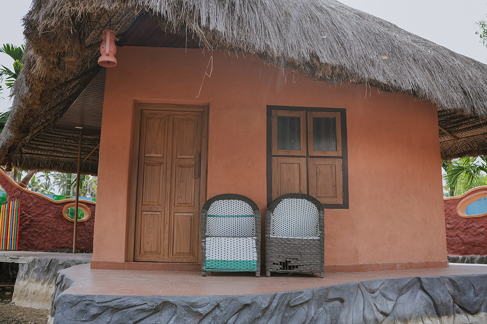 Traditional mud house accommodation at Arco Park ’N’ Resort, Kasaragod