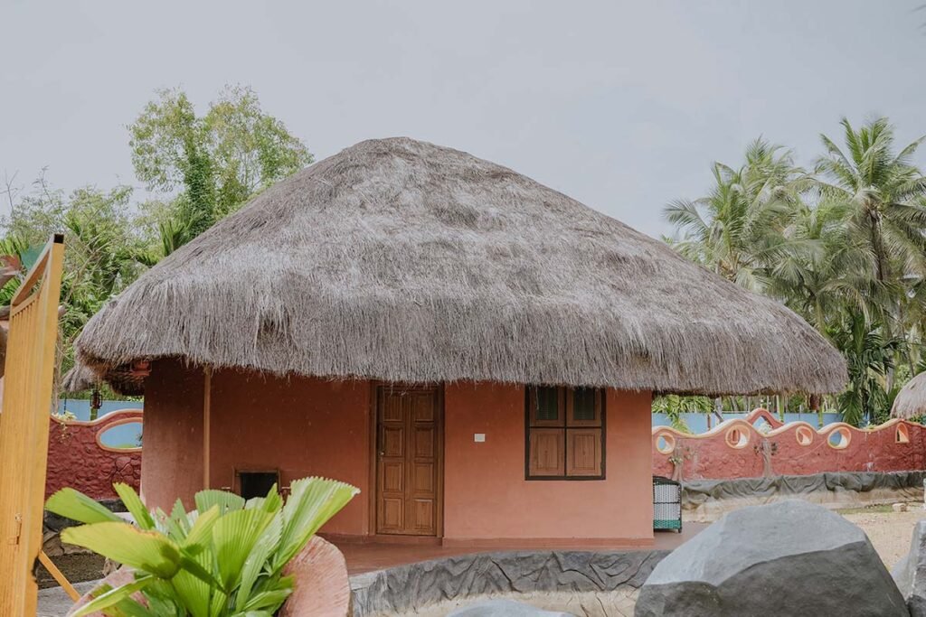Traditional mud house accommodation at Arco Park ’N’ Resort, Kasaragod
